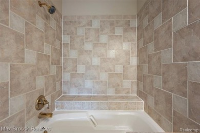 This beautifully maintained condo in the desirable Maples on The Maples Club in Michigan - for sale on GolfHomes.com, golf home, golf lot