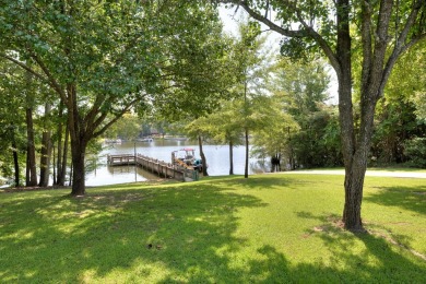 Spectacular 5 BR, 5 BA Lake Marion waterfront home with dock on Players Course At Wyboo Plantation in South Carolina - for sale on GolfHomes.com, golf home, golf lot