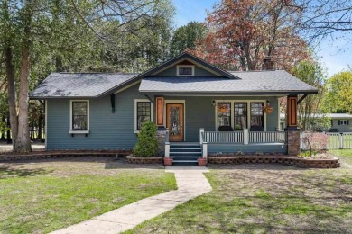 This brilliantly restored home delivers comfort, charm, and on Charlevoix Golf Club in Michigan - for sale on GolfHomes.com, golf home, golf lot