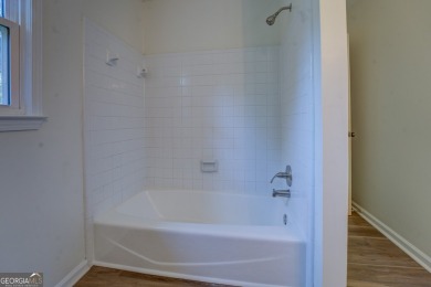 Spacious 2-story home with 4 bedrooms and 2 baths upstairs, a on Honey Creek Country Club in Georgia - for sale on GolfHomes.com, golf home, golf lot