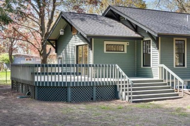 This brilliantly restored home delivers comfort, charm, and on Charlevoix Golf Club in Michigan - for sale on GolfHomes.com, golf home, golf lot