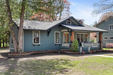 This brilliantly restored home delivers comfort, charm, and on Charlevoix Golf Club in Michigan - for sale on GolfHomes.com, golf home, golf lot