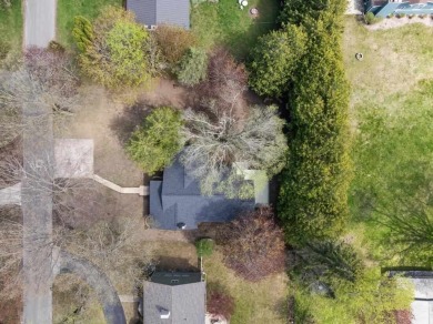 This brilliantly restored home delivers comfort, charm, and on Charlevoix Golf Club in Michigan - for sale on GolfHomes.com, golf home, golf lot