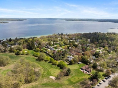 This brilliantly restored home delivers comfort, charm, and on Charlevoix Golf Club in Michigan - for sale on GolfHomes.com, golf home, golf lot