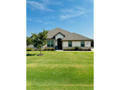 This beautifully designed home offers a blend of modern on Pecan Plantation Country Club in Texas - for sale on GolfHomes.com, golf home, golf lot