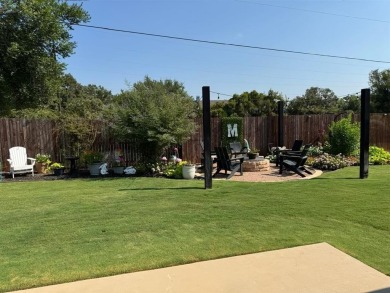 This beautifully designed home offers a blend of modern on Pecan Plantation Country Club in Texas - for sale on GolfHomes.com, golf home, golf lot