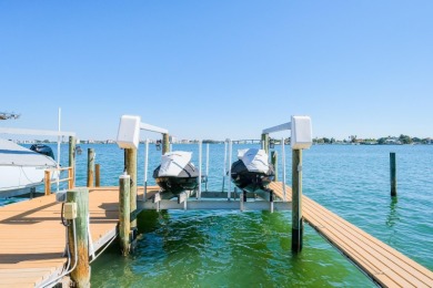 Secluded within the exclusive Boca Ciega Isle neighborhood, this on Isla Del Sol Yacht and Country Club in Florida - for sale on GolfHomes.com, golf home, golf lot