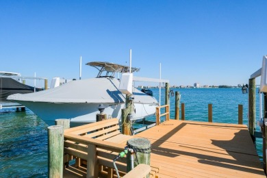 Secluded within the exclusive Boca Ciega Isle neighborhood, this on Isla Del Sol Yacht and Country Club in Florida - for sale on GolfHomes.com, golf home, golf lot
