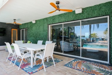 Secluded within the exclusive Boca Ciega Isle neighborhood, this on Isla Del Sol Yacht and Country Club in Florida - for sale on GolfHomes.com, golf home, golf lot