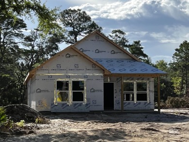 Brand-new construction situated on a peaceful half-acre wooded on Peninsula Golf and Racquet Club in Alabama - for sale on GolfHomes.com, golf home, golf lot