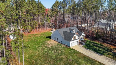 One of a kind ranch sitting on a double lot in a desirable gated on River Golf and County Club at Lake Royale in North Carolina - for sale on GolfHomes.com, golf home, golf lot