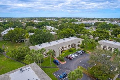 Welcome to your slice of paradise in the heart of Pompano Beach! on Wynmoor Golf Course in Florida - for sale on GolfHomes.com, golf home, golf lot