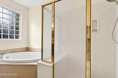 Experience refined living in this meticulously maintained on Ocean Ridge Plantation in North Carolina - for sale on GolfHomes.com, golf home, golf lot