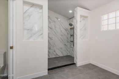 Prepare to be wowed by the freshly remodeled residence awaiting on Desert Lakes Golf Course in Arizona - for sale on GolfHomes.com, golf home, golf lot