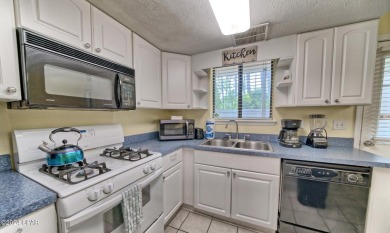 2BR/2.5BA END UNIT townhome with private back patio in a gated on Edgewater Beach Resort in Florida - for sale on GolfHomes.com, golf home, golf lot