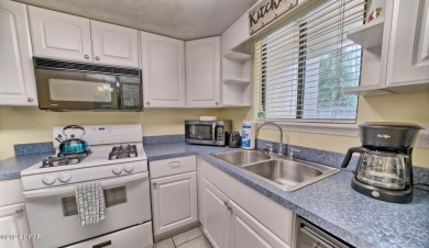 2BR/2.5BA END UNIT townhome with private back patio in a gated on Edgewater Beach Resort in Florida - for sale on GolfHomes.com, golf home, golf lot