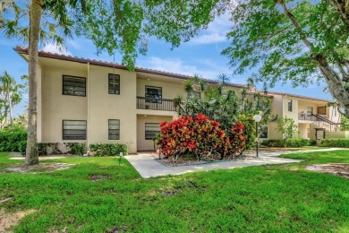 Nestled in a picturesque gated community, this magnificent on Boca Lago Golf and Country Club in Florida - for sale on GolfHomes.com, golf home, golf lot