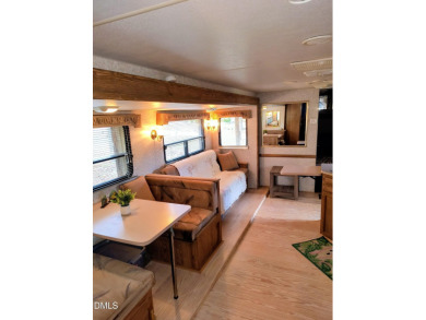 Experience lake life with water views of Lake Royale! This cozy on River Golf and Country Club at Lake Royale in North Carolina - for sale on GolfHomes.com, golf home, golf lot
