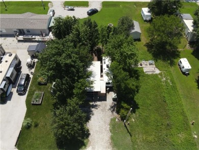 Welcome to your private retreat in the gated lake community of on Linn Valley Lakes - Deer Trace Golf Course in Kansas - for sale on GolfHomes.com, golf home, golf lot