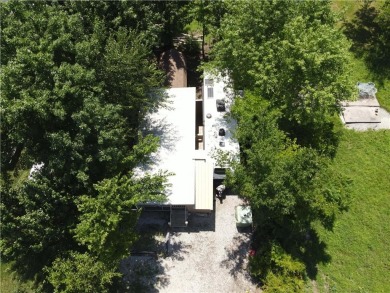 Welcome to your private retreat in the gated lake community of on Linn Valley Lakes - Deer Trace Golf Course in Kansas - for sale on GolfHomes.com, golf home, golf lot