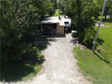 Welcome to your private retreat in the gated lake community of on Linn Valley Lakes - Deer Trace Golf Course in Kansas - for sale on GolfHomes.com, golf home, golf lot