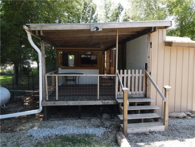 Welcome to your private retreat in the gated lake community of on Linn Valley Lakes - Deer Trace Golf Course in Kansas - for sale on GolfHomes.com, golf home, golf lot