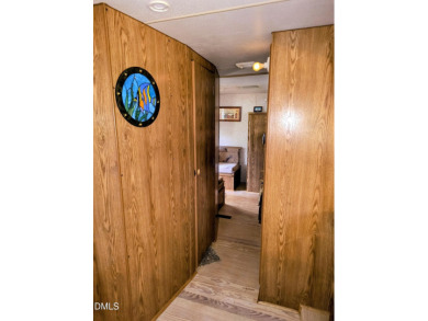 Experience lake life with water views of Lake Royale! This cozy on River Golf and Country Club at Lake Royale in North Carolina - for sale on GolfHomes.com, golf home, golf lot