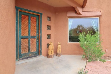 This custom Leo Husky home is a beautiful combination of nature on Paa-Ko Ridge Golf Club  in New Mexico - for sale on GolfHomes.com, golf home, golf lot