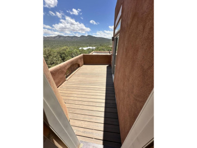 This custom Leo Husky home is a beautiful combination of nature on Paa-Ko Ridge Golf Club  in New Mexico - for sale on GolfHomes.com, golf home, golf lot