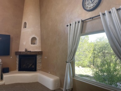 This custom Leo Husky home is a beautiful combination of nature on Paa-Ko Ridge Golf Club  in New Mexico - for sale on GolfHomes.com, golf home, golf lot