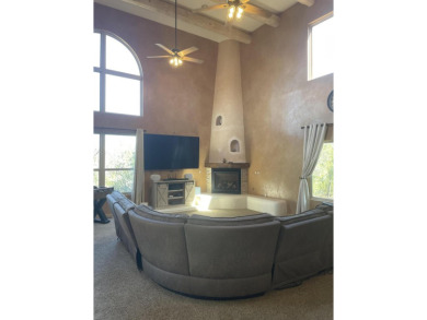 This custom Leo Husky home is a beautiful combination of nature on Paa-Ko Ridge Golf Club  in New Mexico - for sale on GolfHomes.com, golf home, golf lot