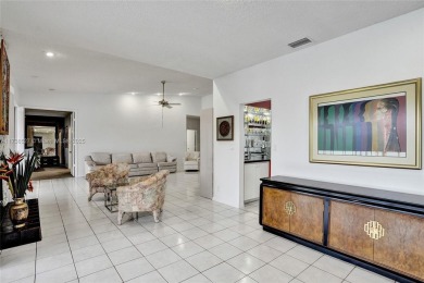 Step into this beautiful 3-bed, 2-bath home in Woodmont's on Woodmont Country Club in Florida - for sale on GolfHomes.com, golf home, golf lot