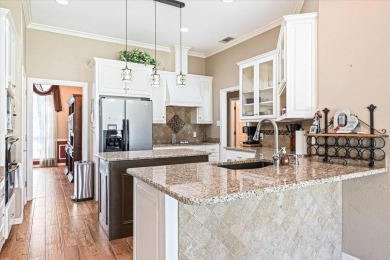 PRIDE OF OWNERSHIP is reflected at every turn in this spacious on Pecan Plantation Country Club in Texas - for sale on GolfHomes.com, golf home, golf lot