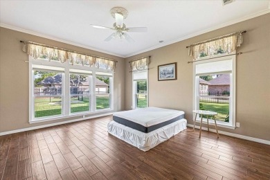 PRIDE OF OWNERSHIP is reflected at every turn in this spacious on Pecan Plantation Country Club in Texas - for sale on GolfHomes.com, golf home, golf lot