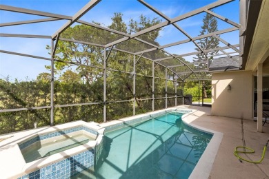 This elegant single-family home in the gated Sandhill Trace on Hunters Creek Golf Course in Florida - for sale on GolfHomes.com, golf home, golf lot