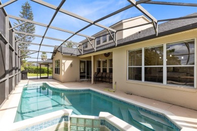 This elegant single-family home in the gated Sandhill Trace on Hunters Creek Golf Course in Florida - for sale on GolfHomes.com, golf home, golf lot