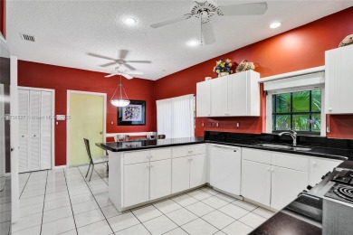 Step into this beautiful 3-bed, 2-bath home in Woodmont's on Woodmont Country Club in Florida - for sale on GolfHomes.com, golf home, golf lot