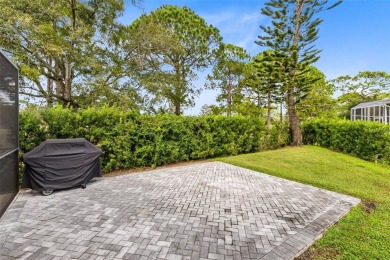 This elegant single-family home in the gated Sandhill Trace on Hunters Creek Golf Course in Florida - for sale on GolfHomes.com, golf home, golf lot