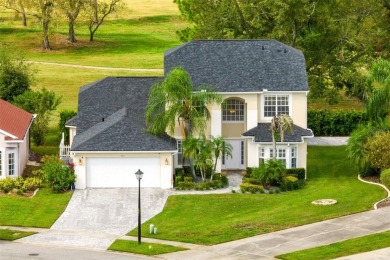 This elegant single-family home in the gated Sandhill Trace on Hunters Creek Golf Course in Florida - for sale on GolfHomes.com, golf home, golf lot