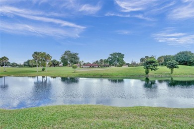 Step into this beautiful 3-bed, 2-bath home in Woodmont's on Woodmont Country Club in Florida - for sale on GolfHomes.com, golf home, golf lot