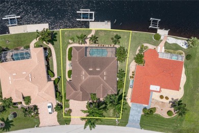 PUNTA GORDA ISLES WATERFRONT HOME W/91FT OF SEAWALL & SAIL on Saint Andrews South Golf Club in Florida - for sale on GolfHomes.com, golf home, golf lot