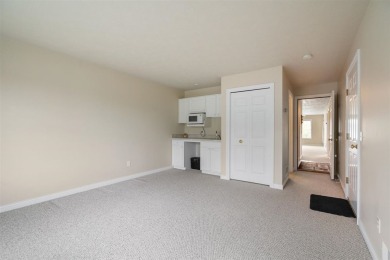Welcome to this upper-level 2-bedroom, 2-bath condo in the on Charlevoix Golf and Country Club in Michigan - for sale on GolfHomes.com, golf home, golf lot