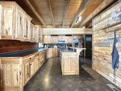 Opportunity awaits! Gorgeous log home living on a quiet street on Lake Perry Country Club in Kansas - for sale on GolfHomes.com, golf home, golf lot