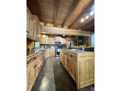 Opportunity awaits! Gorgeous log home living on a quiet street on Lake Perry Country Club in Kansas - for sale on GolfHomes.com, golf home, golf lot