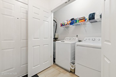 This Champions condo in the vibrant golf community of Sea Trail on Sea Trail Golf Resort in North Carolina - for sale on GolfHomes.com, golf home, golf lot