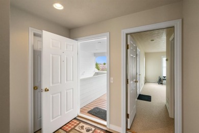 Welcome to this upper-level 2-bedroom, 2-bath condo in the on Charlevoix Golf and Country Club in Michigan - for sale on GolfHomes.com, golf home, golf lot