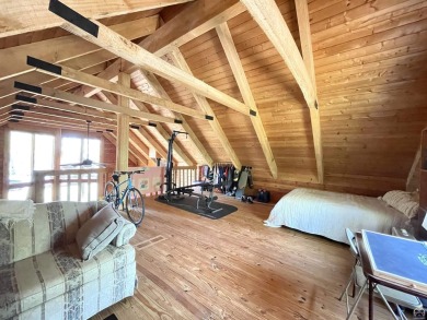 Opportunity awaits! Gorgeous log home living on a quiet street on Lake Perry Country Club in Kansas - for sale on GolfHomes.com, golf home, golf lot