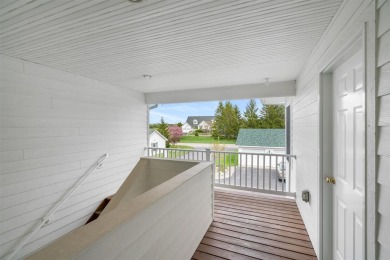 Welcome to this upper-level 2-bedroom, 2-bath condo in the on Charlevoix Golf and Country Club in Michigan - for sale on GolfHomes.com, golf home, golf lot