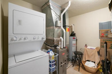 Welcome to this upper-level 2-bedroom, 2-bath condo in the on Charlevoix Golf and Country Club in Michigan - for sale on GolfHomes.com, golf home, golf lot
