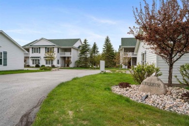 Welcome to this upper-level 2-bedroom, 2-bath condo in the on Charlevoix Golf and Country Club in Michigan - for sale on GolfHomes.com, golf home, golf lot